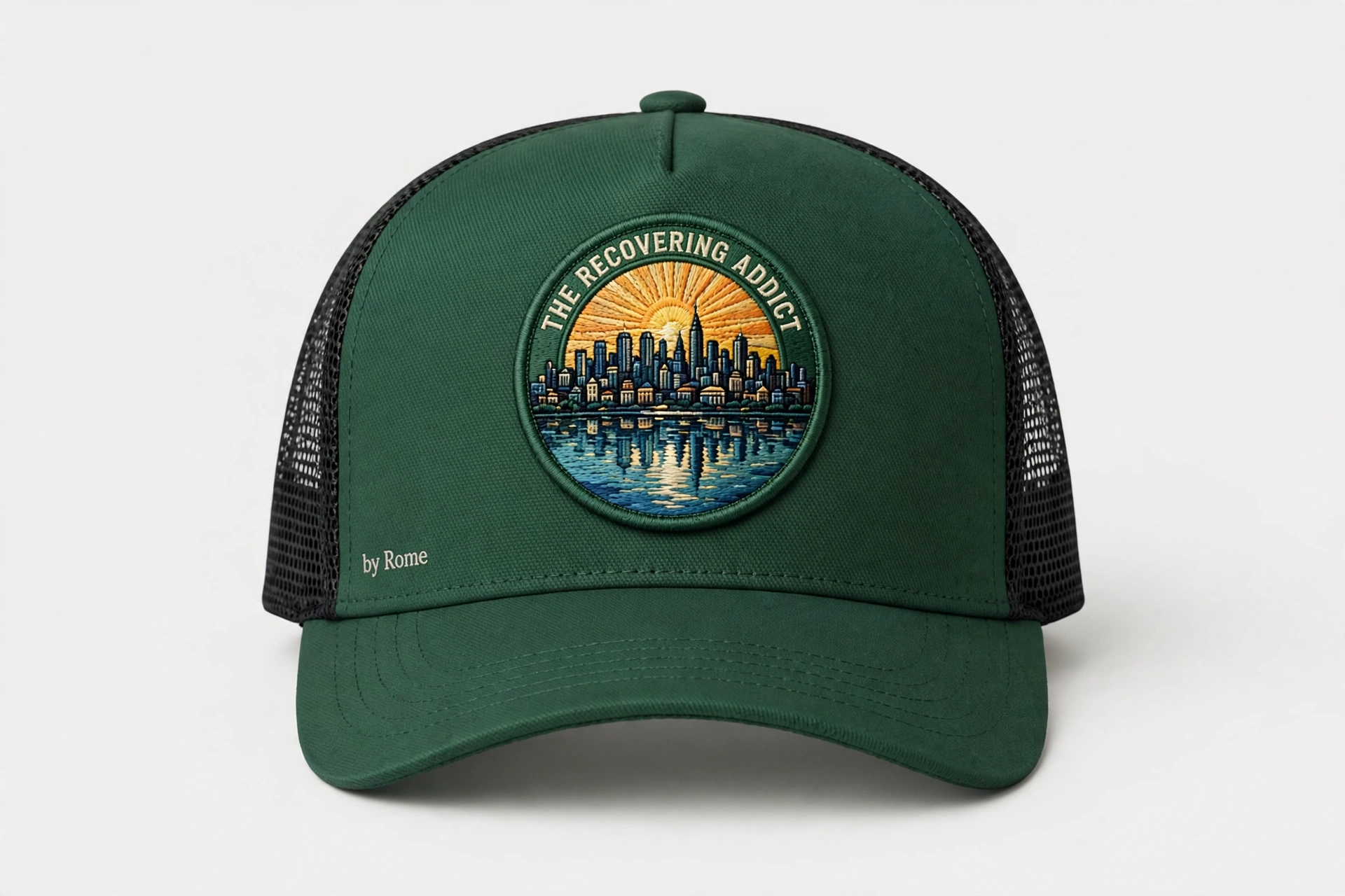 Loden trucker hat with a round The Recovering Addict Minneapolis sunrise, skyline, and river patch